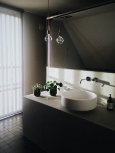 white ceramic sink and natural light