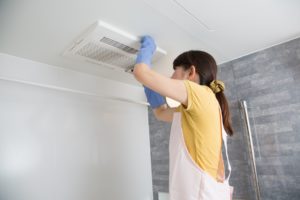 woman housekeeping ventilation cleaning