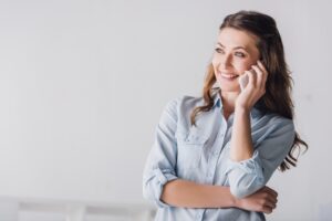 smiling adult woman talking on phone