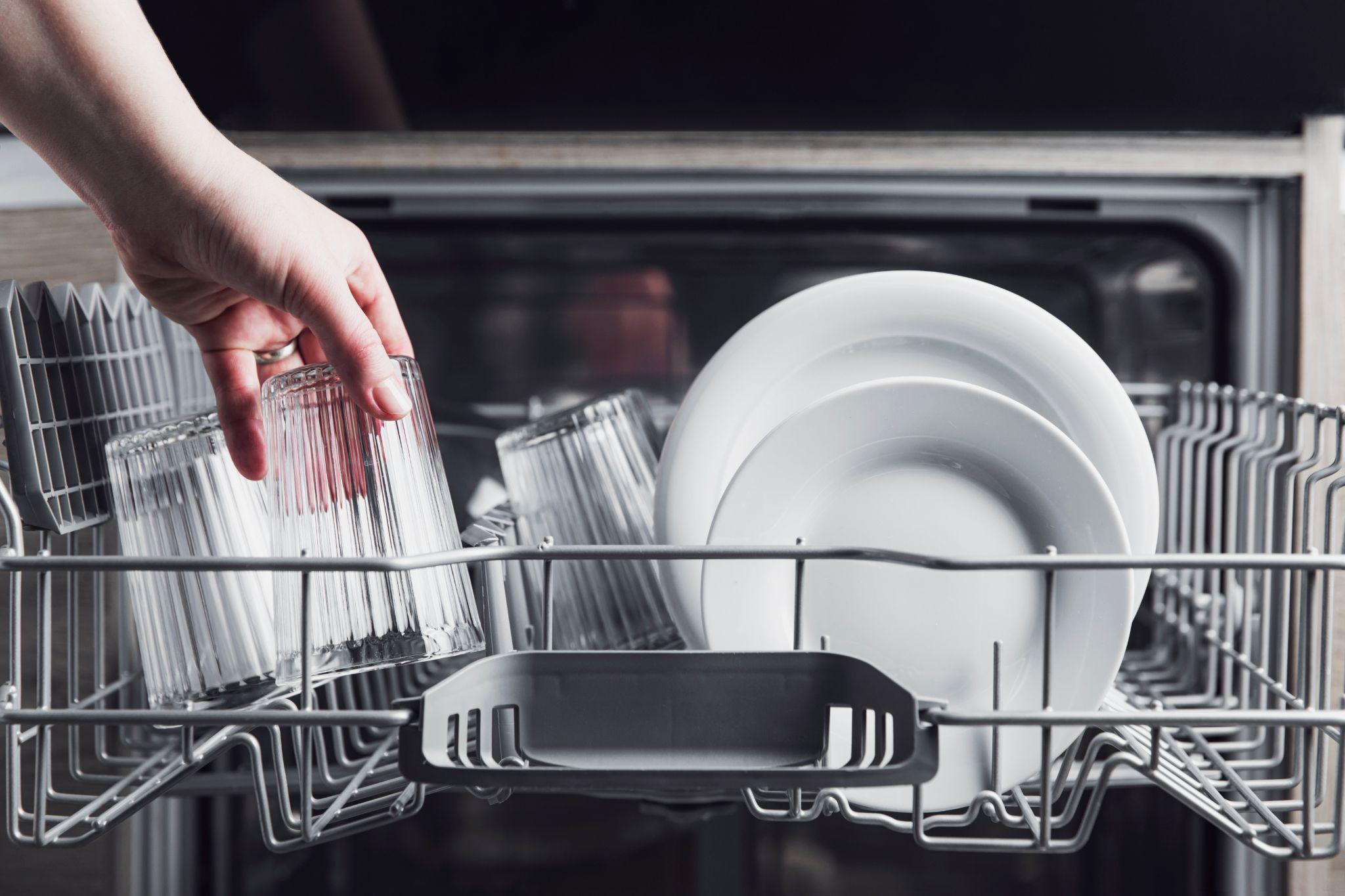 Person loading up the dishwasher