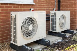 New heat pumps installed outside a modern home